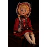 An Armand & Marseille (Germany) bisque head and painted composition bodied doll, the bisque head