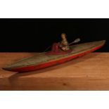 An early 20th century German tinplate and clockwork rowing boat, fitted with a lone oarsman figure