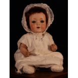 An Edmund Edelmann (Germany) bisque head and painted composition bodied doll, the bisque head with