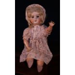 An Armand & Marseille (Germany) bisque head and ball jointed painted composition bodied doll, the