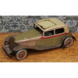An early 20th century tinplate and clockwork saloon car, the lithographed tin body in olive drab