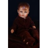 A Dean's Rag Book Co. Ltd. painted composition head and stuffed cloth bodied doll, velveteen