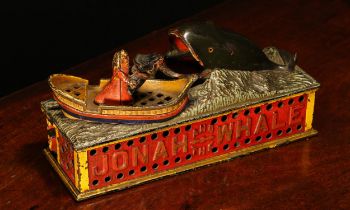Americana - a late 19th century painted cast iron mechanical money box or bank, Jonah and the Whale,