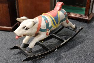 Folk Art - a carved and painted wooden rocking Pig, the carved and painted Pig with pricked ears,