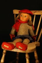 A Dean's Rag Book Co cloth doll, the pressed moulded felt face with painted features including