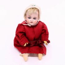 A German bisque head and ball jointed painted composition bodied doll, the bisque head with weighted