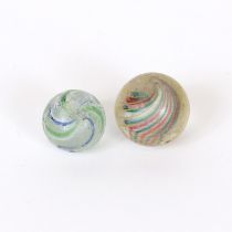 Juvenalia - an early 20th century solid core swirl glass marble, the inner core section in red white