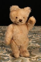 A 1950's Steiff (Germany) blonde mohair jointed miniature teddy bear, brown and black plastic