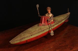 An early 20th century German tinplate and clockwork rowing boat, fitted with a lone oarsman figure