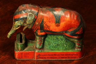 An early 20th century novelty tinplate money box or bank, Royal Trick Elephant Bank, modelled as a
