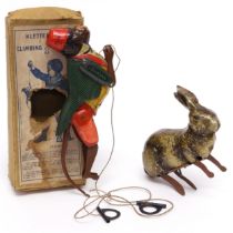 An early 20th century tinplate and clockwork toy, in the form of a Rabbit, lithographed detail,