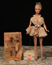 A rare 1950's or 1960's Bild-Lilli (Germany) 11½" jointed plastic doll, the swivel head with painted