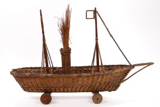 English Folk Art/Maritime Interest - a late 19th century wickerwork pull-along carpet toy, in the