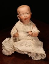 A Kämmer & Reinhardt (Germany) bisque head and painted composition 'Kaiser Baby' character doll, the