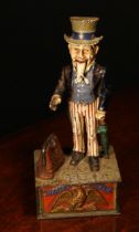 Americana - a late 19th century painted cast iron mechanical money box or bank, Uncle Sam Bank,