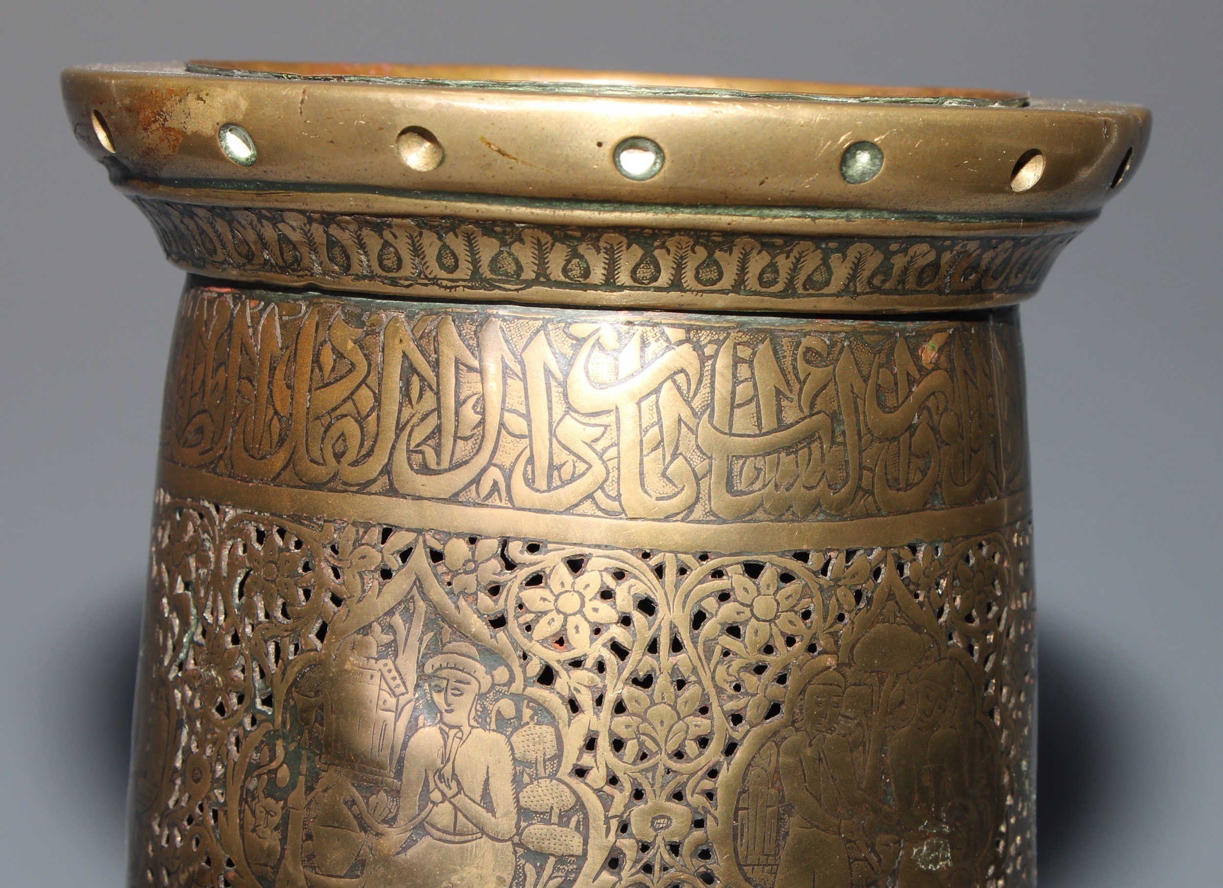 A pair of large Middle Eastern Islamic brass mosque candlesticks, pierced and engraved with a field - Image 4 of 12