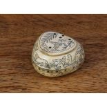 A scrimshaw horn heart shaped snuff box, engraved overall with a hunting scene, 4cm wide