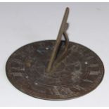 A 19th century brass sun dial, shaped gnomon, 20cm diam