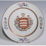 A French armorial porcelain plate, painted in the Chinese export taste in the famille rose