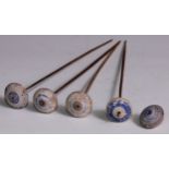 Antiquities - five Ancient Egyptian spindle whorls, painted in rings with lapis blue, 3cm diam