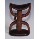 Tribal Art - an African headrest, dished top, inverted double U-shaped structure, 22cm high,