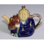 A 19th century majolica Chinaman teapot, 21cm long, c.1870