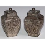 A pair of Japanese antimony square bombe shaped tea caddies, each with push fitting cover enclosig a