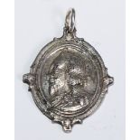 The English Civil War - a silver coloured metal Royalist commemorative pendant, with a profile
