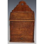 A 19th century oak salt box, shaped cresting, hinged sloping cover, drawer to base, 35cm high