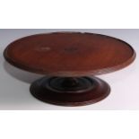 An Edwardian mahogany lazy Susan, circular top with slight gallery, turned pillar and base, 47.5cm