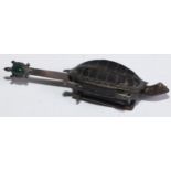 A Chinese bronze lock, cast as a turtle, the key with a hatchling set with a green stone cabochon,