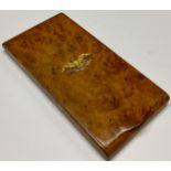 A Biedermeier gilt metal mounted burr maple snuff or tobacco box, in the Empire taste, the flush-
