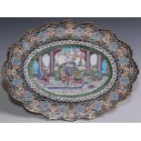 An Islamic Middle Eastern enamel shaped oval dish, painted in polychrome in the Persian taste with