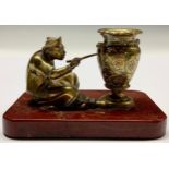 A 19th century gilt bronze and marble desk novelty, as a Chinese man painting a vase, rounded