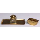 A Secessionist period brass desk suite, comprising rounded rectangular inkstand and blotter, glass