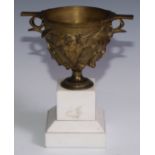 A 19th century gilt bronze krater shaped mantel urn, after the Antique, cast in relief with fruiting
