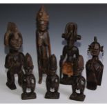 Tribal Art - a Chokwe figure, 36cm high, Angola; three Yoruba figures, 23cm high, Nigeria, others,