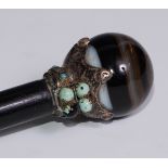 An early 20th century silver coloured metal mounted banded agate and turquoise mounted walking