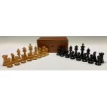 A boxwood and ebony Staunton pattern chess set, marked for King's side, the Kings 7cm high, mahogany