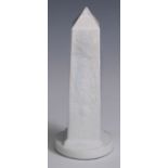 A 19th century opaque pressed glass obelisk, circular base, 22cm high, c.1880