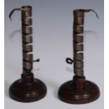 A pair of 19th century iron spiral candlesticks, turned bases, 22.5cm high