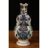 A Dutch Delft flattened double-gourd vase, painted in the Iznik palette in the Persian taste, 23cm