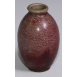 A Chinese monochrome high-fired stoneware ovoid vase, glazed in mottled tones of peach bloom, 11cm