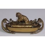 A 19th century gilt metal inkstand, the cover cast with a retriever dog, enclosing a pair of