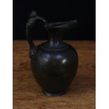 A Grand Tour bronze ewer, after the antique, inspired by an Ancient Greek hydria, figural handle,