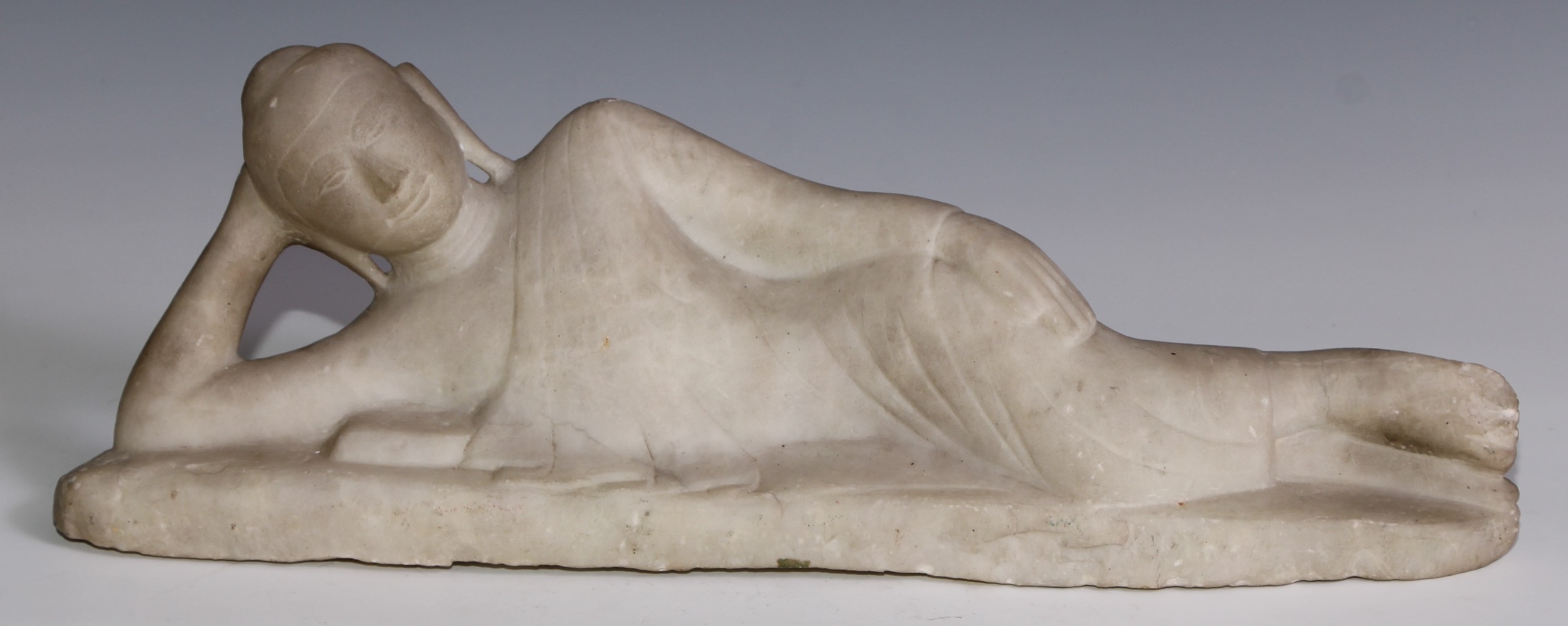 Asian School (19th century), a white marble, Reclining Buddha, 50cm wide