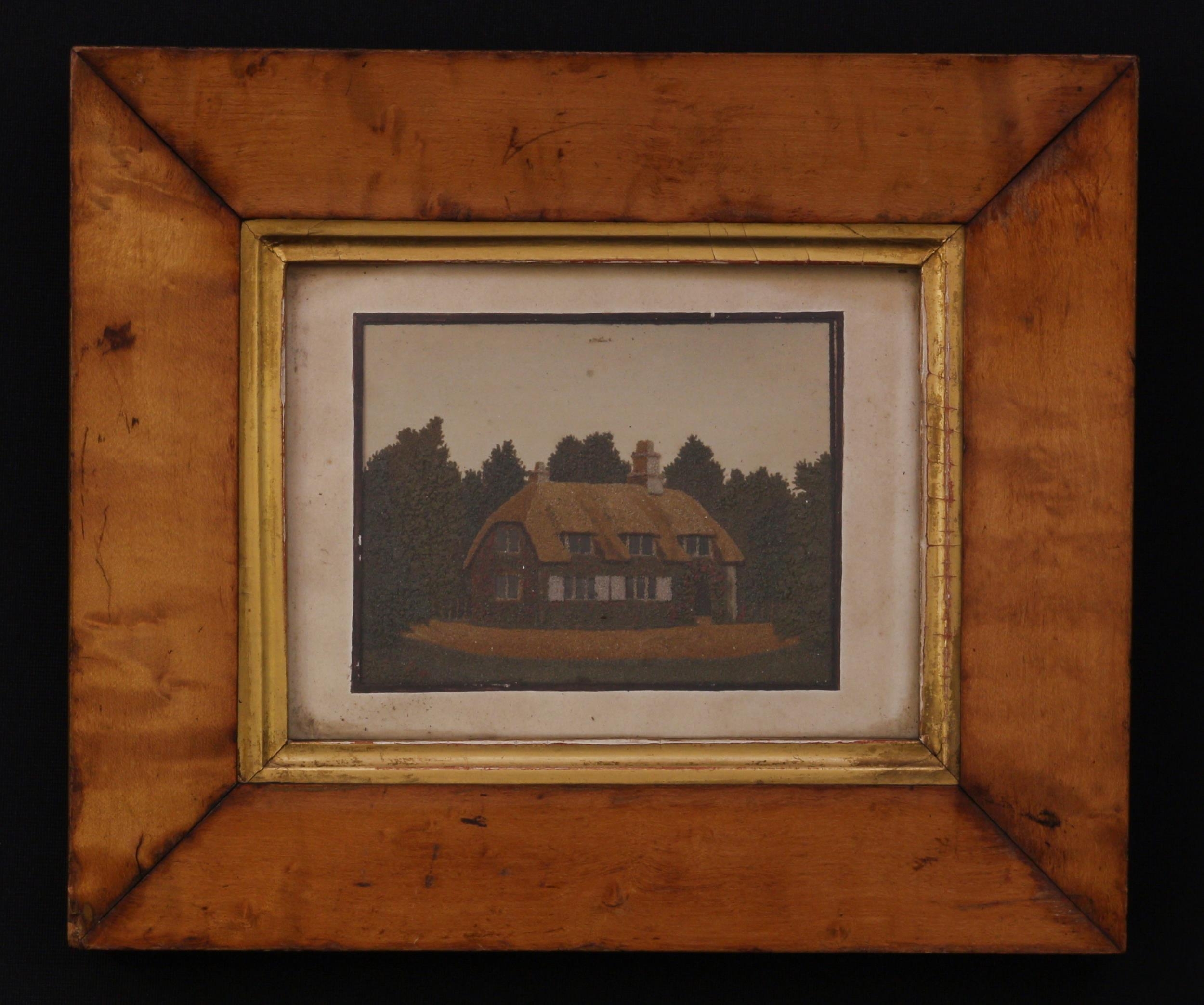 A 19th century sand picture, probably Isle of Wight, depicting a thatched cottage, 7.5cm x 10cm,