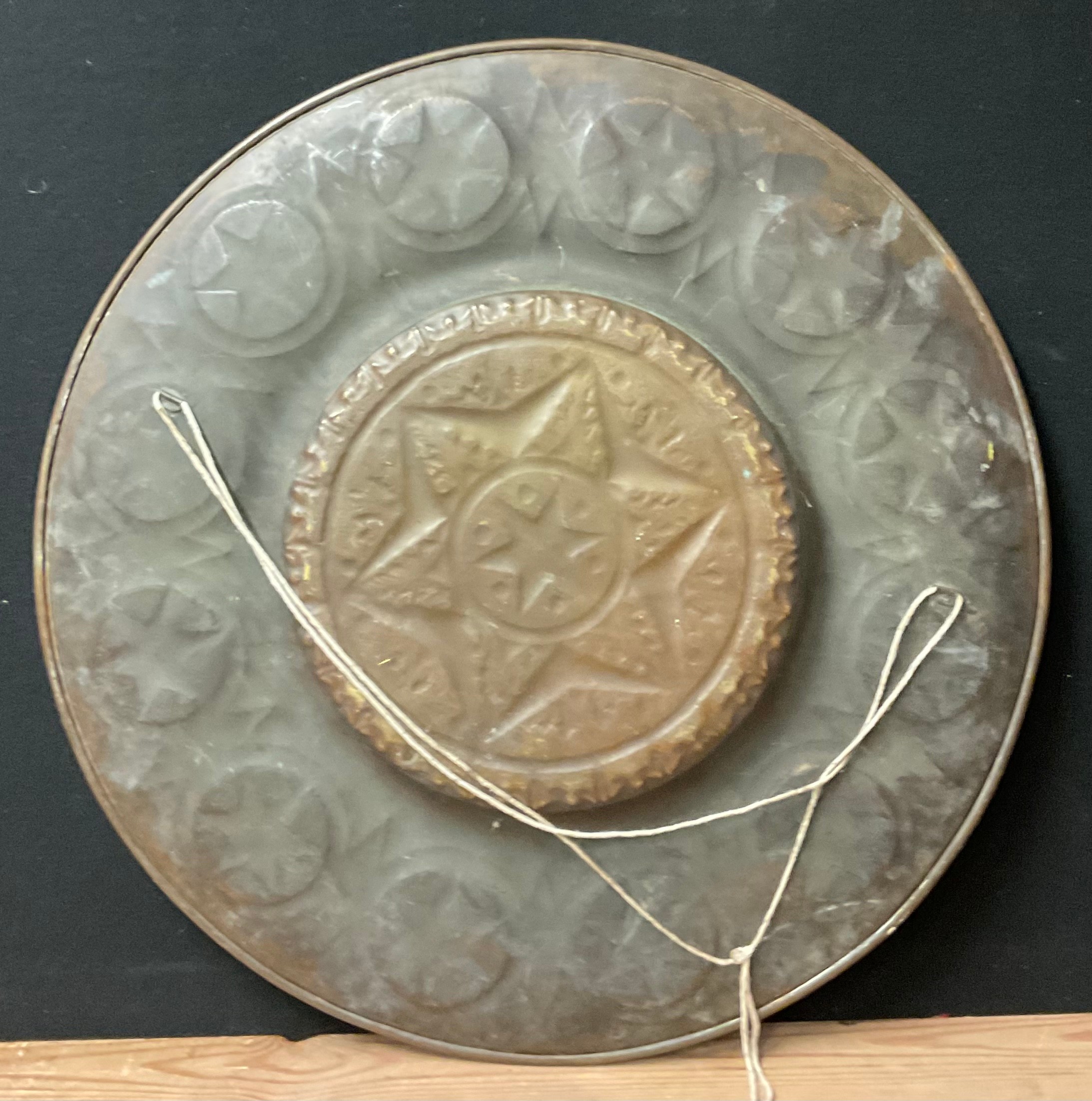 A large Middle Eastern brass charger or alms dish, chases with stars, 66.5cm diam, early 20th - Image 2 of 2