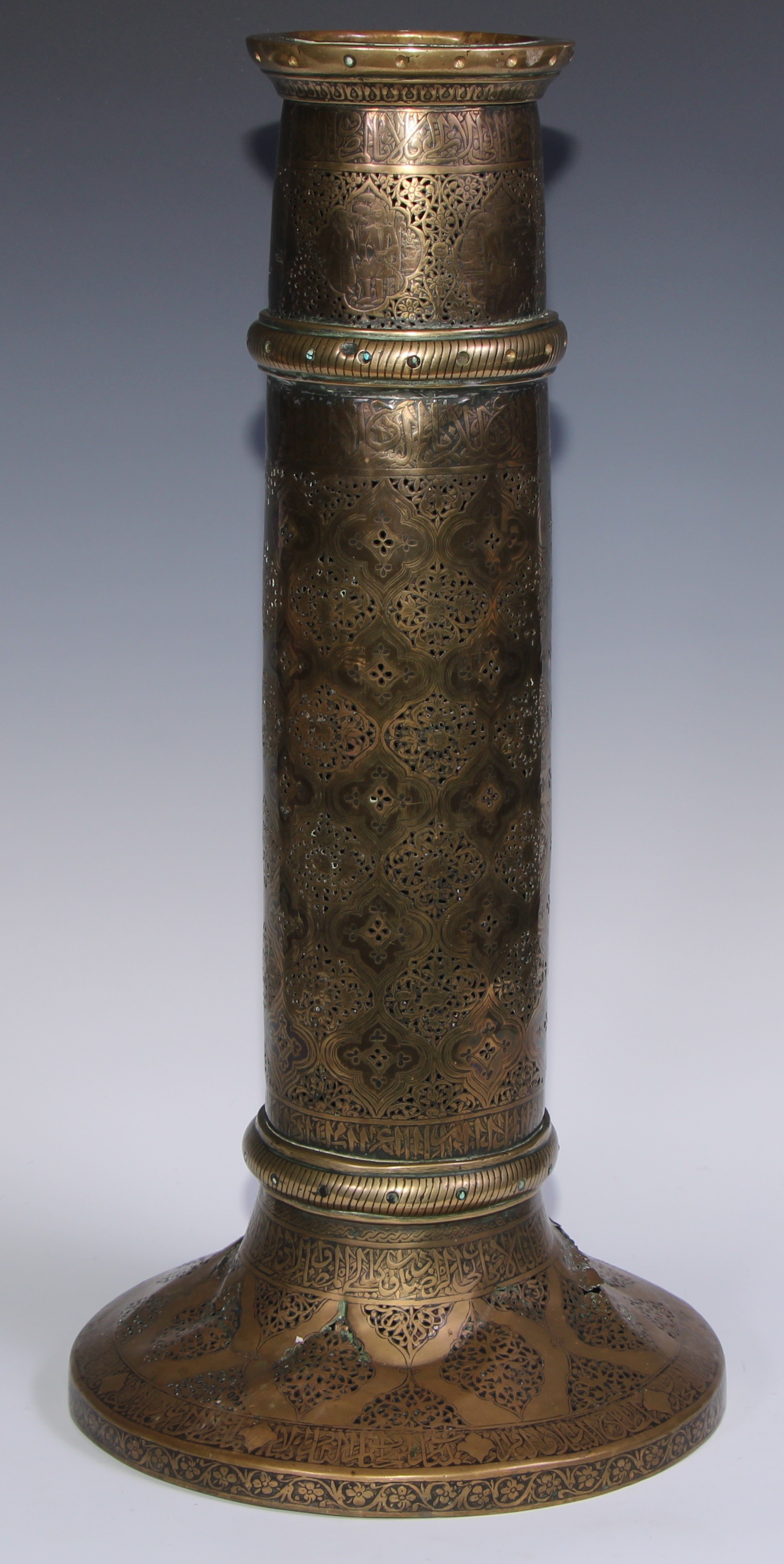 A pair of large Middle Eastern Islamic brass mosque candlesticks, pierced and engraved with a field - Image 10 of 12