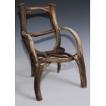 An unusual country house child's chair, formed from stag antlers, 43cm high